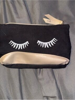 ipsy Black Cosmetic Pouch with White Eyelash Print and Gold Trim